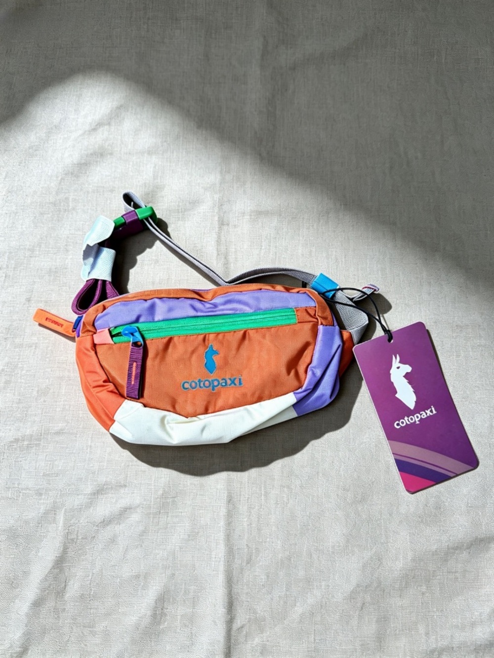 cotopaxi men’s Colorblock Mini Hip Pack in Orange, Purple & Green